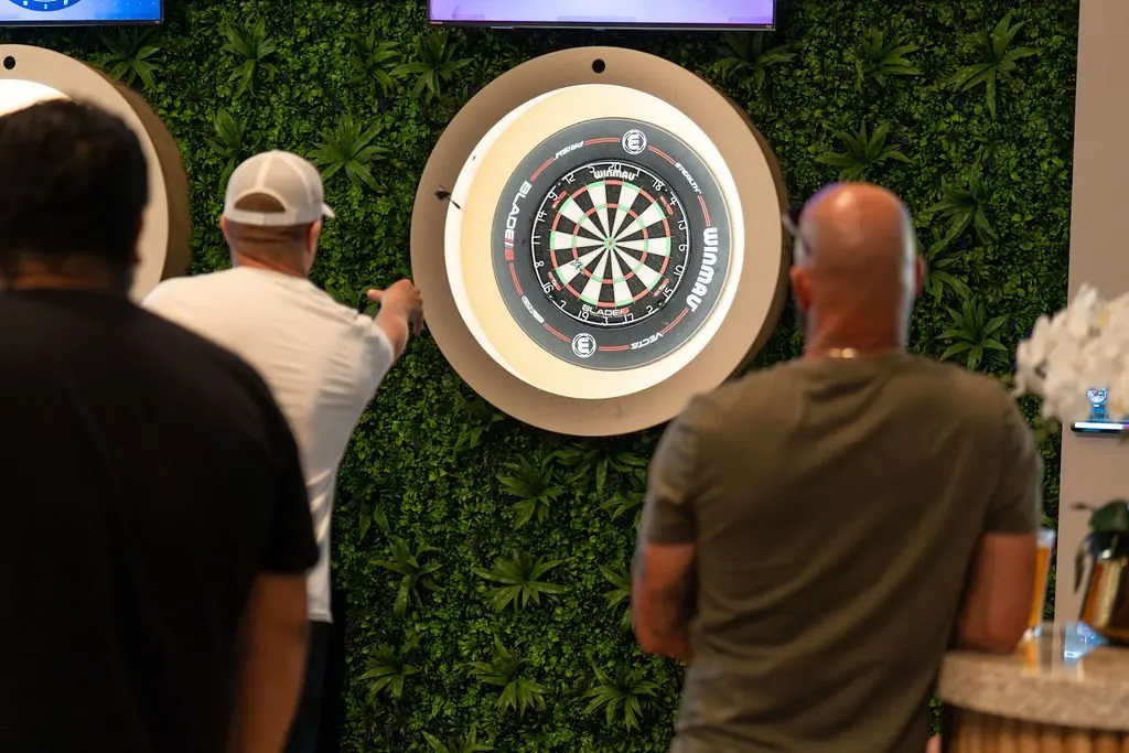 Guests playing darts at At Fault