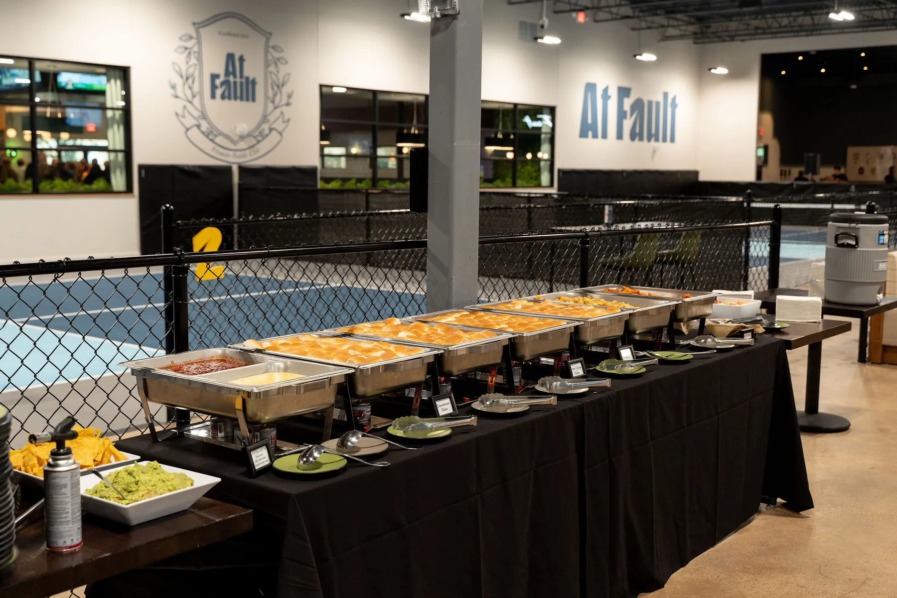 Buffet service set up beside the pickleball courts at At Fault