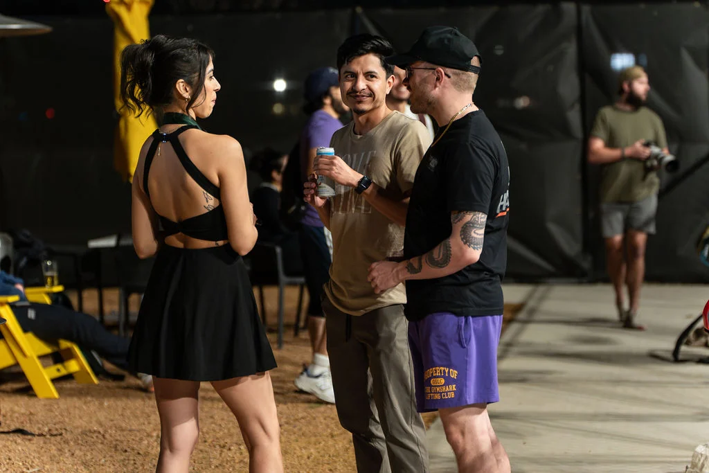 Guests mingle outside on the At Fault patio during an event